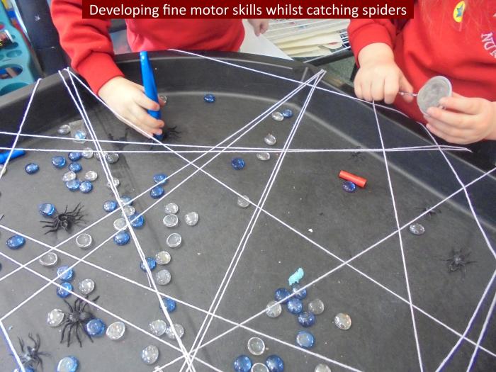 2 Developing fine motor skills whilst catching spiders